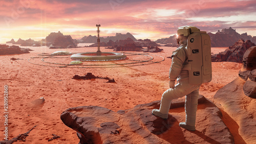 astronaut on planet Mars, looking at a martian colony