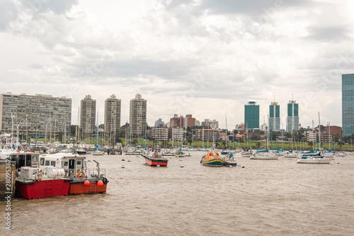 Costa del Rio de la Plata with small boats and sailboats in diving port in Uruguay