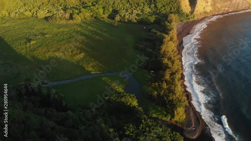 Waimanu Valley beach at sunrise, a high up shot of the valley camping area as well as beach photo