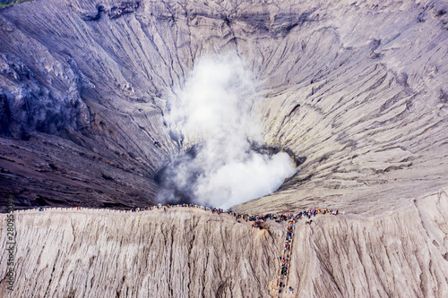 Photography Crowded tourist hiking crater of Bromo volcano