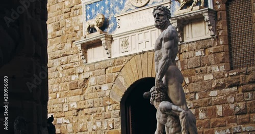 Outdoor view of gorgeous statue of Hercules in Florence city. Beautiful artwork sculpture of greek demigod mythology in Loggia dei Lanzi. Tour around Piazza della Signoria.