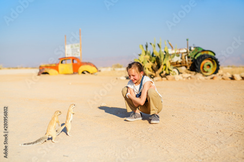 Young girl and ground squirrels photo