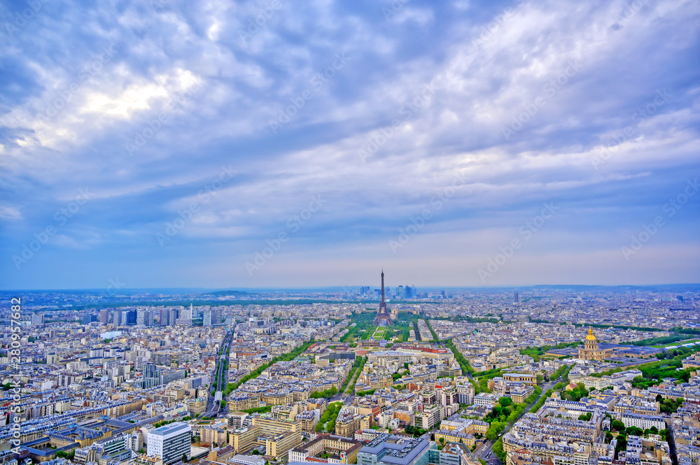 An aerial view of the Eiffel Tower and Paris, France at dusk..