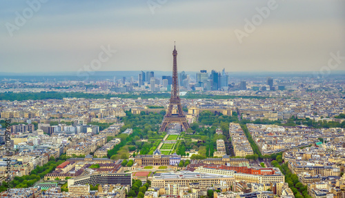 An aerial view of the Eiffel Tower and Paris, France at dusk.. © Jbyard