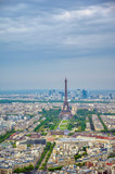 An aerial view of the Eiffel Tower and Paris, France at dusk..