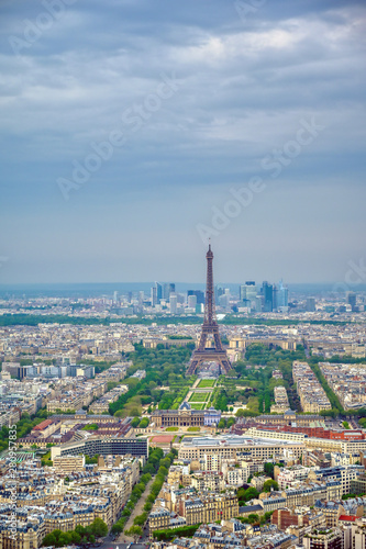 An aerial view of the Eiffel Tower and Paris, France at dusk.. © Jbyard