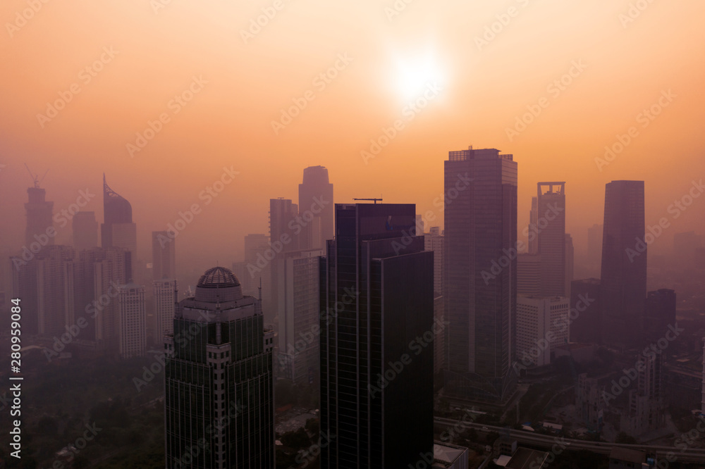 Office buildings with dust smog at sunset
