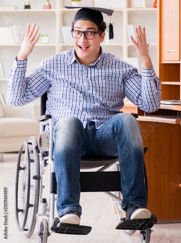 Disabled student studying at home on wheelchair © Elnur