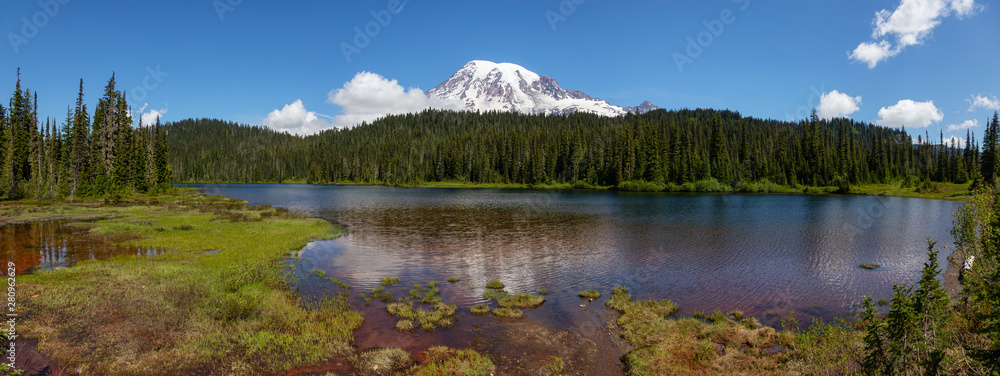 Beautiful Panoramic View of Reflection Lake with Mt Rainier in the background during a sunny summer day. Taken in Paradise, Mt Rainier National Park, Washington, United States of America.