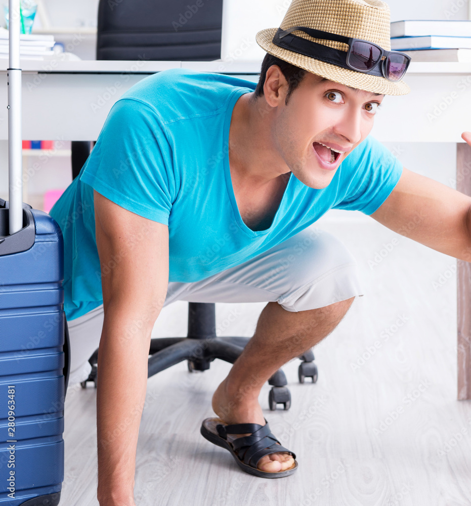 Businessman preparing for vacation in the office Businessman preparing for vacation in the office