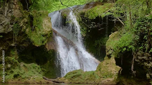 La Vaioaga waterfall encountered while trekking on Nera Gorges during summer, Romania photo