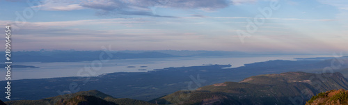 Beautiful Panoramic view of Canadian Mountain Landscape during a vibrant summer sunset. Taken at Mt Arrowsmith  near Nanaimo  Vancouver Island  BC  Canada.