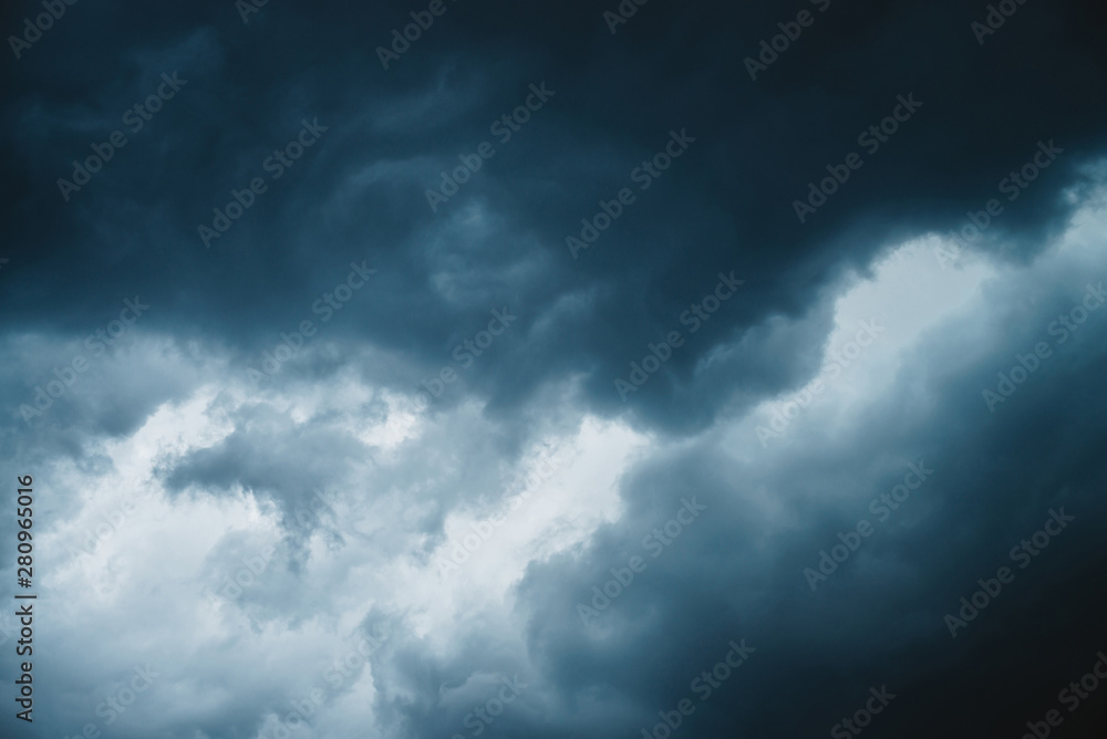 Dramatic cloudscape texture. Dark heavy thunderstorm clouds before rain. Overcast rainy bad weather. Storm warning. Natural blue background of cumulonimbus. Nature backdrop of stormy cloudy sky.