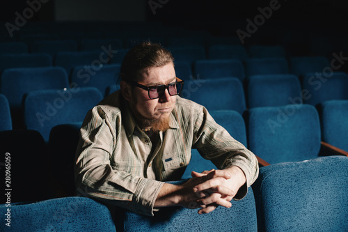 Foto Director by one in dark theater hall