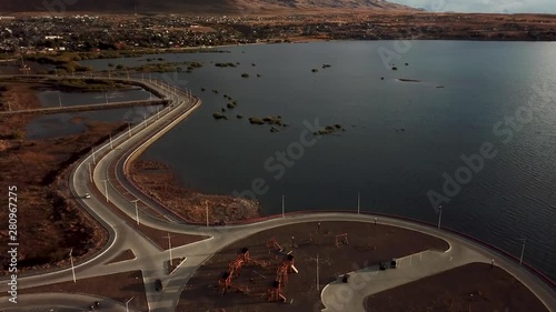 Drone shots of El Calafate in Argentina, at the end of the day, movement of drone and cars. photo