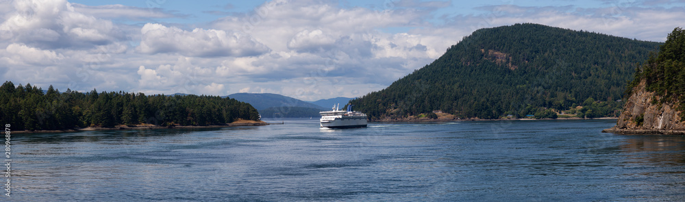 Beautiful Panoramic View of a Ferry Boat passing in the Gulf Islands Narrows during a sunny summer day. Taken near Vancouver Island, British Columbia, Canada.