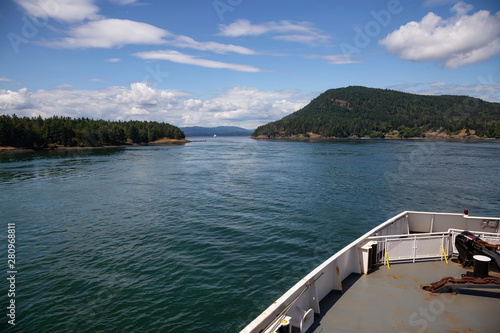 Beautiful View of a Ferry Boat passing in the Gulf Islands Narrows during a sunny summer day. Taken near Vancouver Island, British Columbia, Canada.