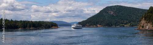 Beautiful Panoramic View of a Ferry Boat passing in the Gulf Islands Narrows during a sunny summer day. Taken near Vancouver Island, British Columbia, Canada. © edb3_16