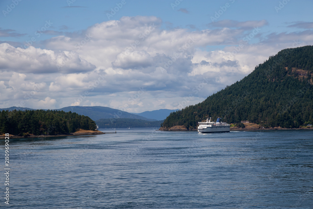 Beautiful View of a Ferry Boat passing in the Gulf Islands Narrows during a sunny summer day. Taken near Vancouver Island, British Columbia, Canada.