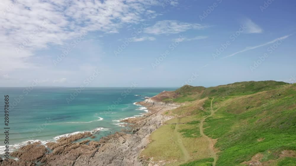 Aerial Flyover of a Coastal Headland in North Devon on a Summer’s Day Aerial Flyover of a Coastal Headland in North Devon on a Summer’s Day