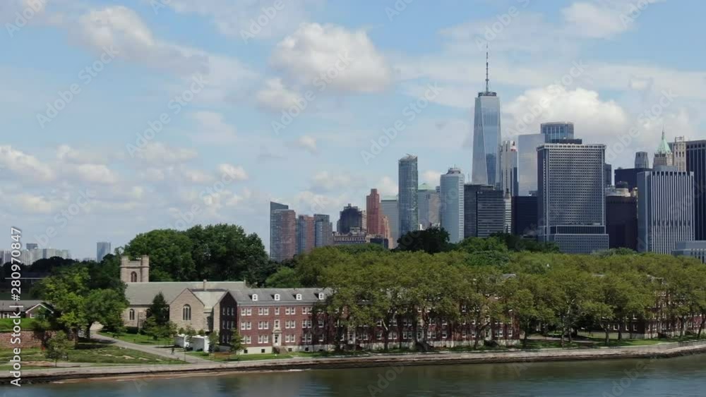 Left to right dolly aerial of downtown NY skyline; Freedom tower; Beautiful sunny day with clouds; 4k Left to right dolly aerial of downtown NY skyline; Freedom tower; Beautiful sunny day with clouds; 4k