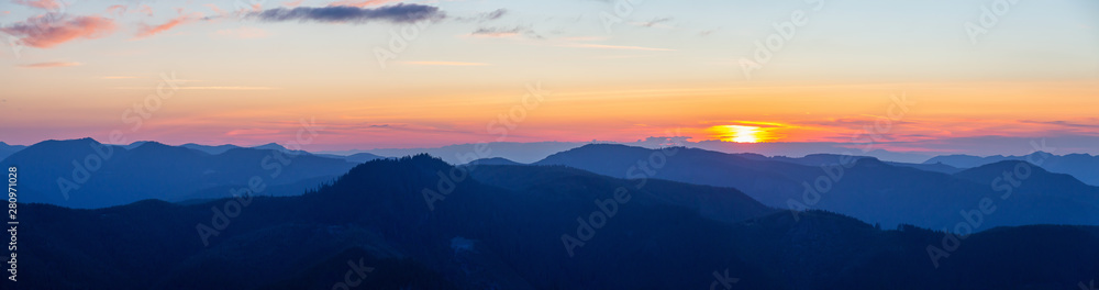 Beautiful Panoramic View of American Mountain Landscape during a vibrant and colorful summer sunset. Taken from Sun Top Lookout, in Mt Rainier National Park, South of Seattle, Washington, USA. Beautiful Panoramic View of American Mountain Landscape during a vibrant and colorful summer sunset. Taken from Sun Top Lookout, in Mt Rainier National Park, South of Seattle, Washington, USA.