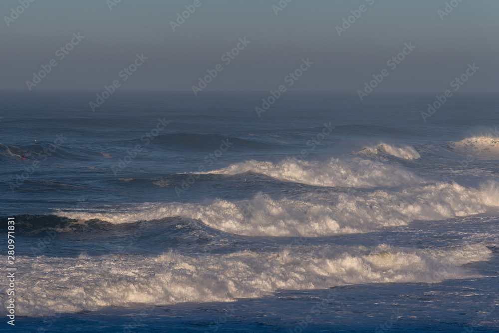 Foamy Atlantic waves next to Nazare, Portugal.