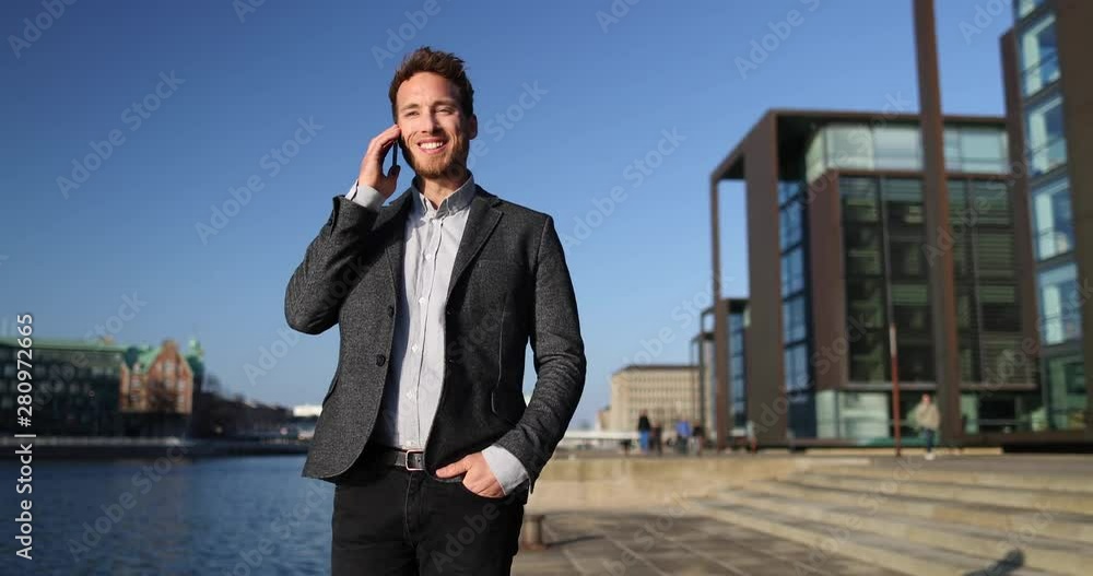 Successful Business Man Talking Using Smartphone Walking and Standing in Big City Business District Street. SLOW MOTION 59.94 FPS. Successful Business Man Talking Using Smartphone Walking and Standing in Big City Business District Street. SLOW MOTION 59.94 FPS.