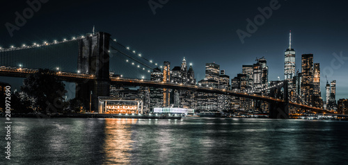 Fototapeta Naklejka Na Ścianę i Meble -  Brooklyn Bridge and Jane's Carousel steps from lower Manhattan