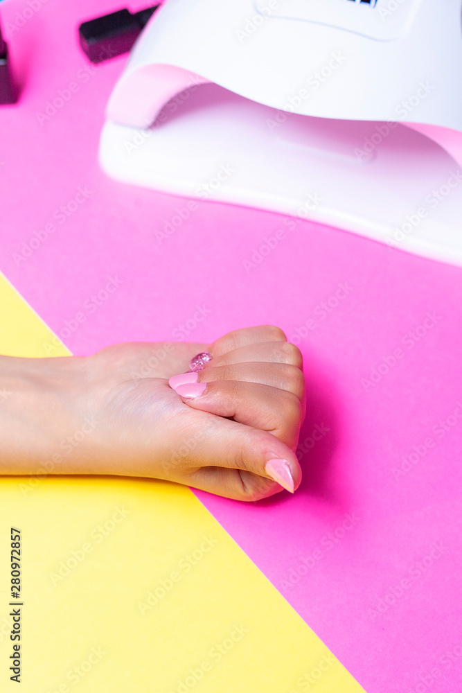 Female's hands after manicure procedure. Concept of nail polish art or shellac Female's hands after manicure procedure. Concept of nail polish art or shellac