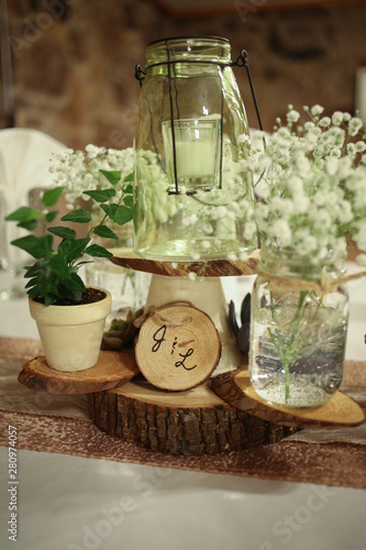 Wedding Photography Bridal Reception Table Centerpiece with Wood, Greenery, Candle in a Jar, and Baby's Breath