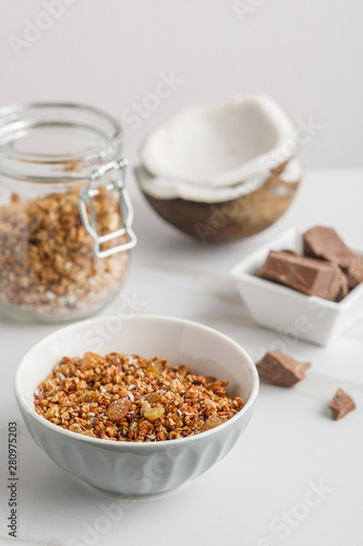 Close-up view of bowl with granola with coconuts and chocolate