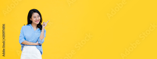Fotografie Asian woman pointing her finger to confirm