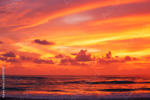 Dramatic sunset sky over the tropical sea.