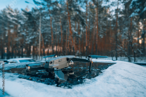 Wallpaper Mural quadrocopter standing on the roof of a snow-covered car Torontodigital.ca