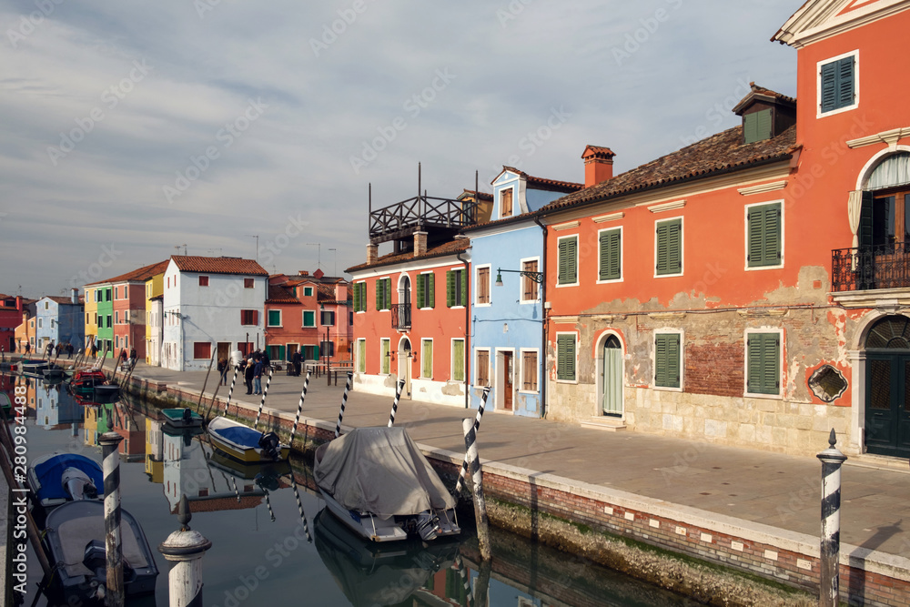 Burano island, traditional colored houses and narrow canal