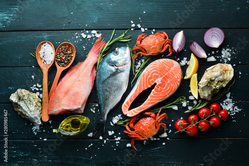 Seafood on a black wooden b...