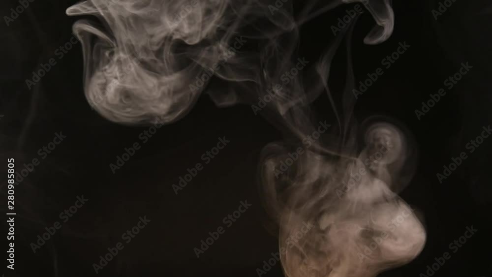 Atmospheric smoke Fog effect. VFX Element. Haze background. Abstract smoke cloud. Smoke in slow motion on black background. White smoke slowly floating through space against black background. Atmospheric smoke Fog effect. VFX Element. Haze background. Abstract smoke cloud. Smoke in slow motion on black background. White smoke slowly floating through space against black background.