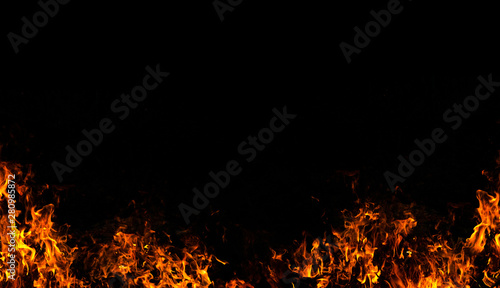 Fire flames on Abstract art black background, Burning red hot sparks rise from large fire in, Fiery orange glowing