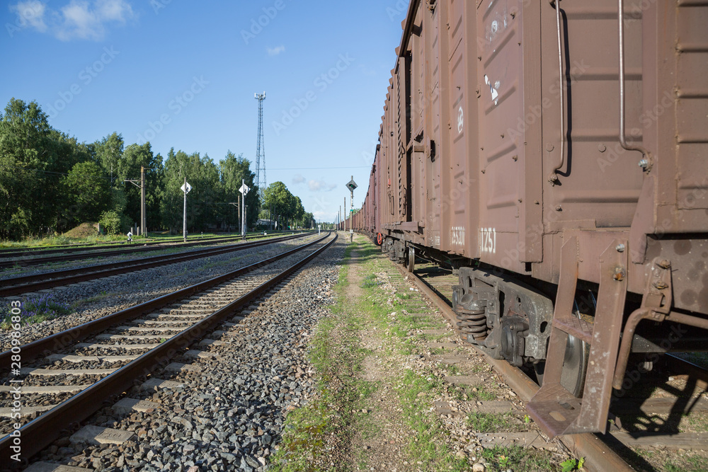 City Riga, Latvia Republic. A freight wagon is standing on a rail track. Juny 28. 2019 Travel photo. City Riga, Latvia Republic. A freight wagon is standing on a rail track. Juny 28. 2019 Travel photo.