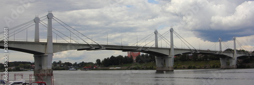 Road bridge in Tver region, Kimry on the background of the Volga river and summer cloudy sky, inscription Kimry on embankment photo