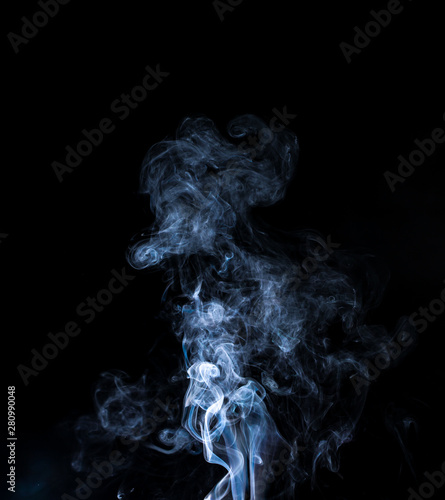 jet of gray smoke on a black background