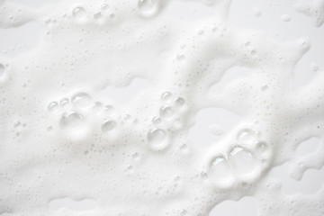 Abstract background white soapy foam texture. Shampoo foam with bubbles