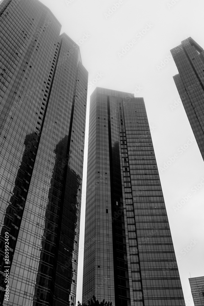 Obraz premium Detail view on top of three Skyscrapers of Hanwha Resort Haeundae. Haeundae-gu, Busan, South Korea. Asia.