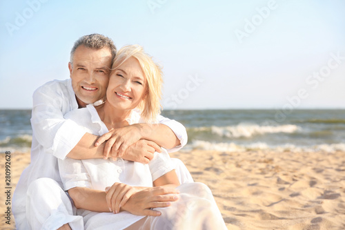 Happy mature couple at sea ...