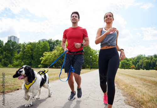 Morning running with dog and partner