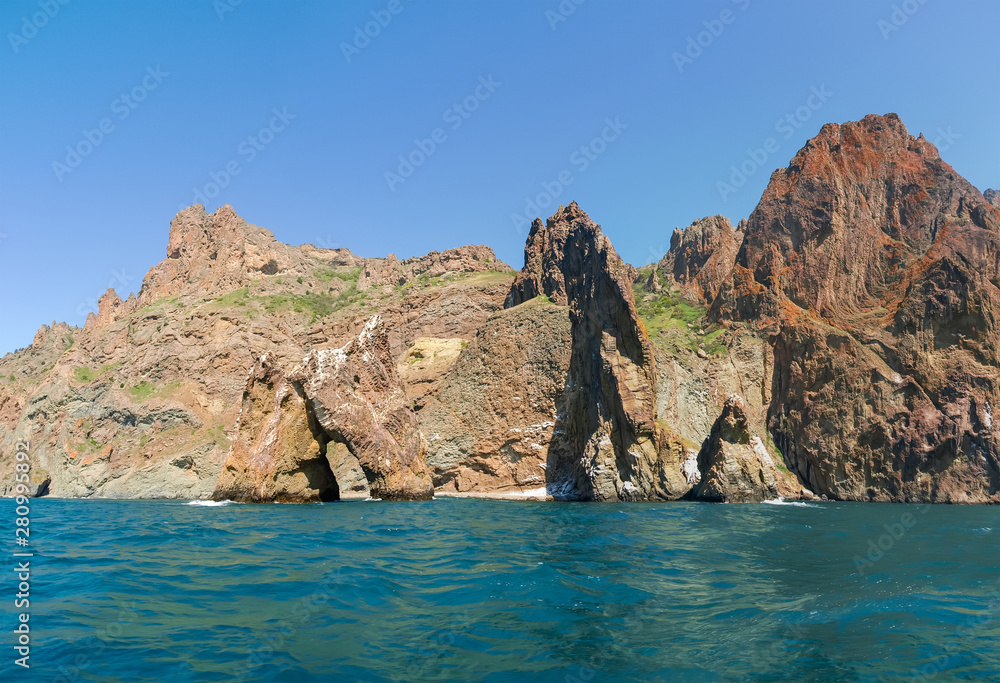 Part of coastal cliffs of volcanic origin on sea shore