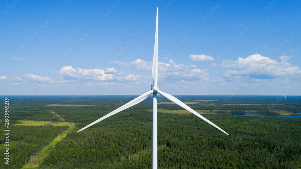 Wind turbine in summer forest, close up. Colorful aerial landscape. Alternative energy concept. - obrazy, fototapety, plakaty 