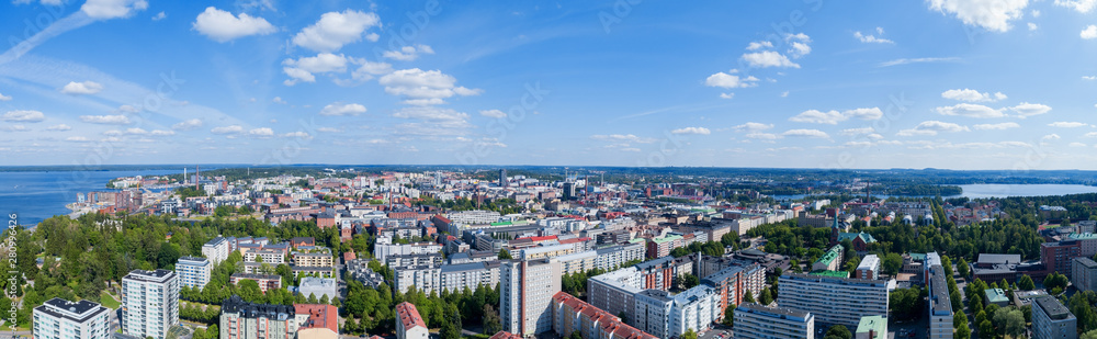 Panorama of the Tampere city at sunny summer day. Blue sky and beautiful clouds. Panorama of the Tampere city at sunny summer day. Blue sky and beautiful clouds.
