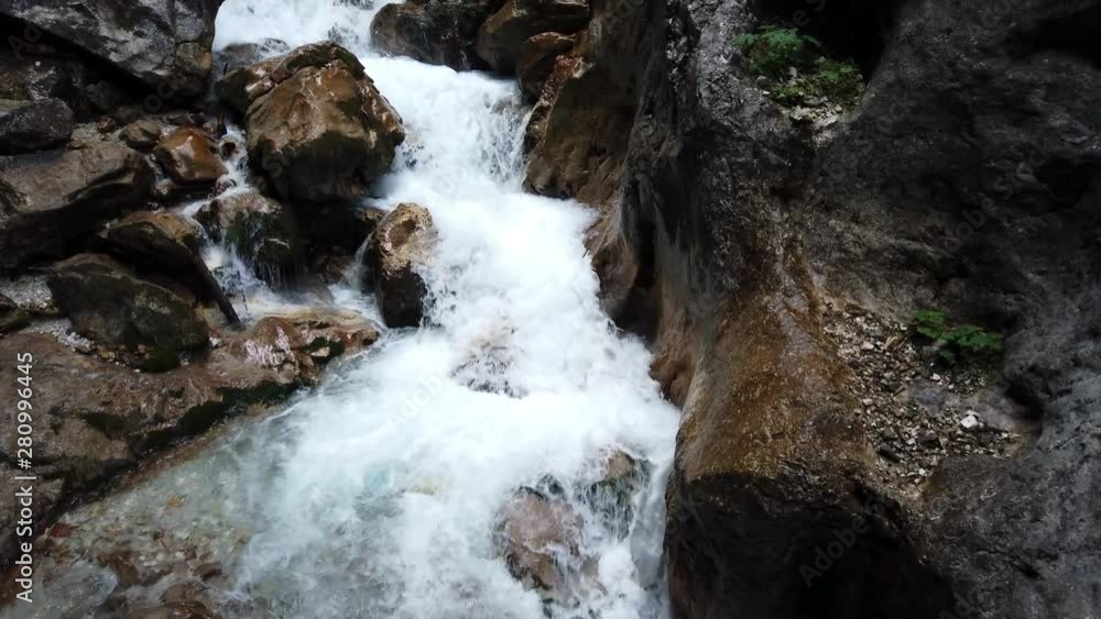 Tilt upwards of fast flowing powerful german alpine river, Höllentalklamm in Germany Tilt upwards of fast flowing powerful german alpine river, Höllentalklamm in Germany